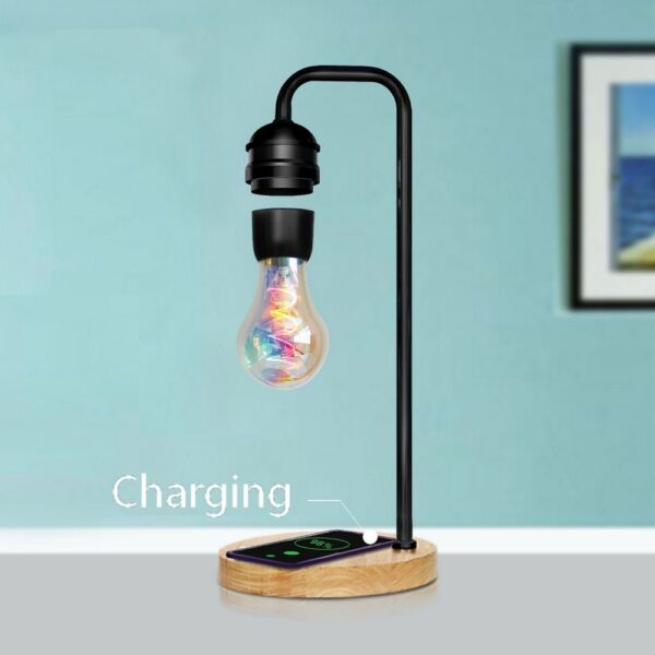 Ọhụrụ LED Magnetic Levitation Bulb Hover Floating Desk Lamp Magic Black Tech Wireless Charger maka ekwentị